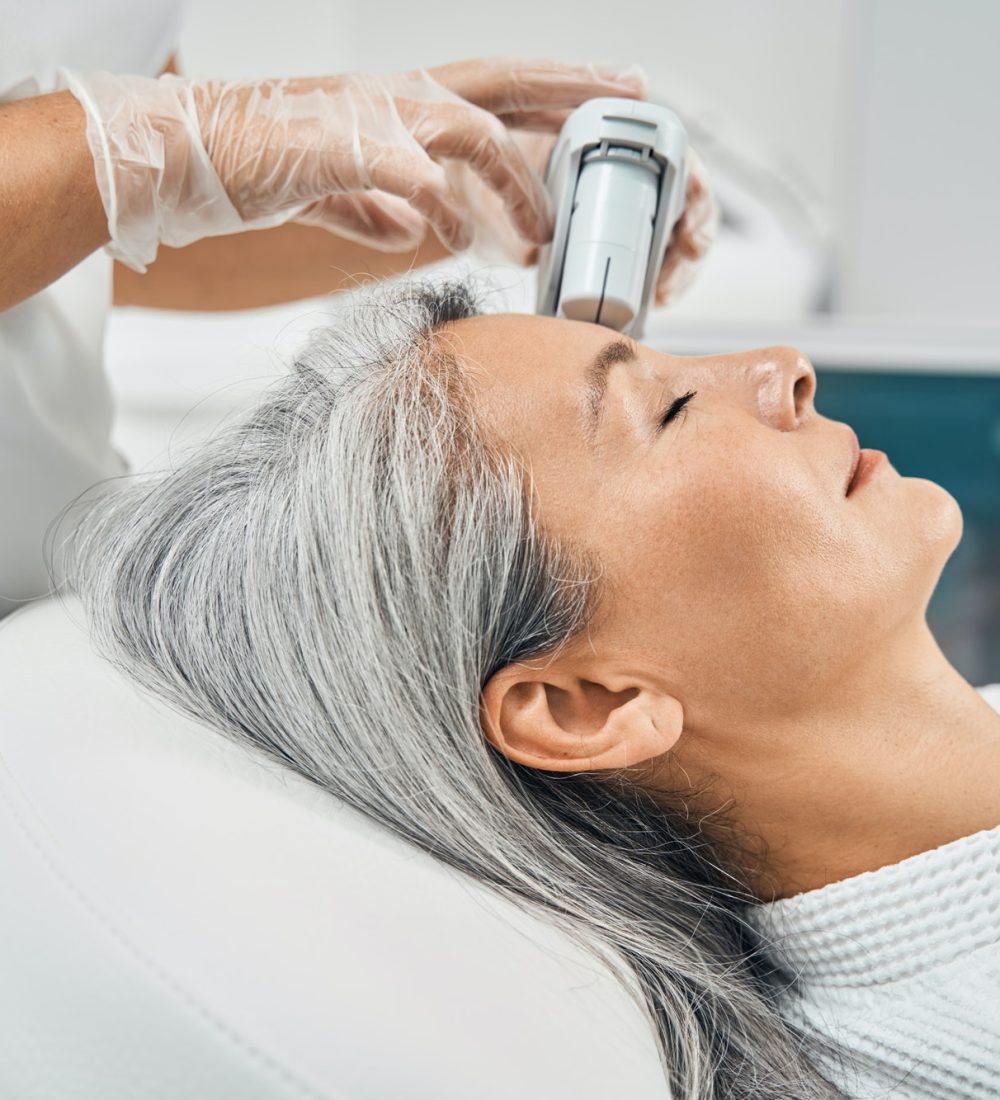 aged-female-person-doing-face-lifting-massage