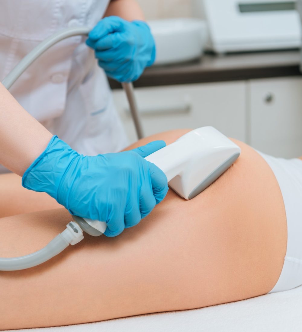 cropped-view-of-cosmetologist-with-roller-doing-buttocks-starvac-massage